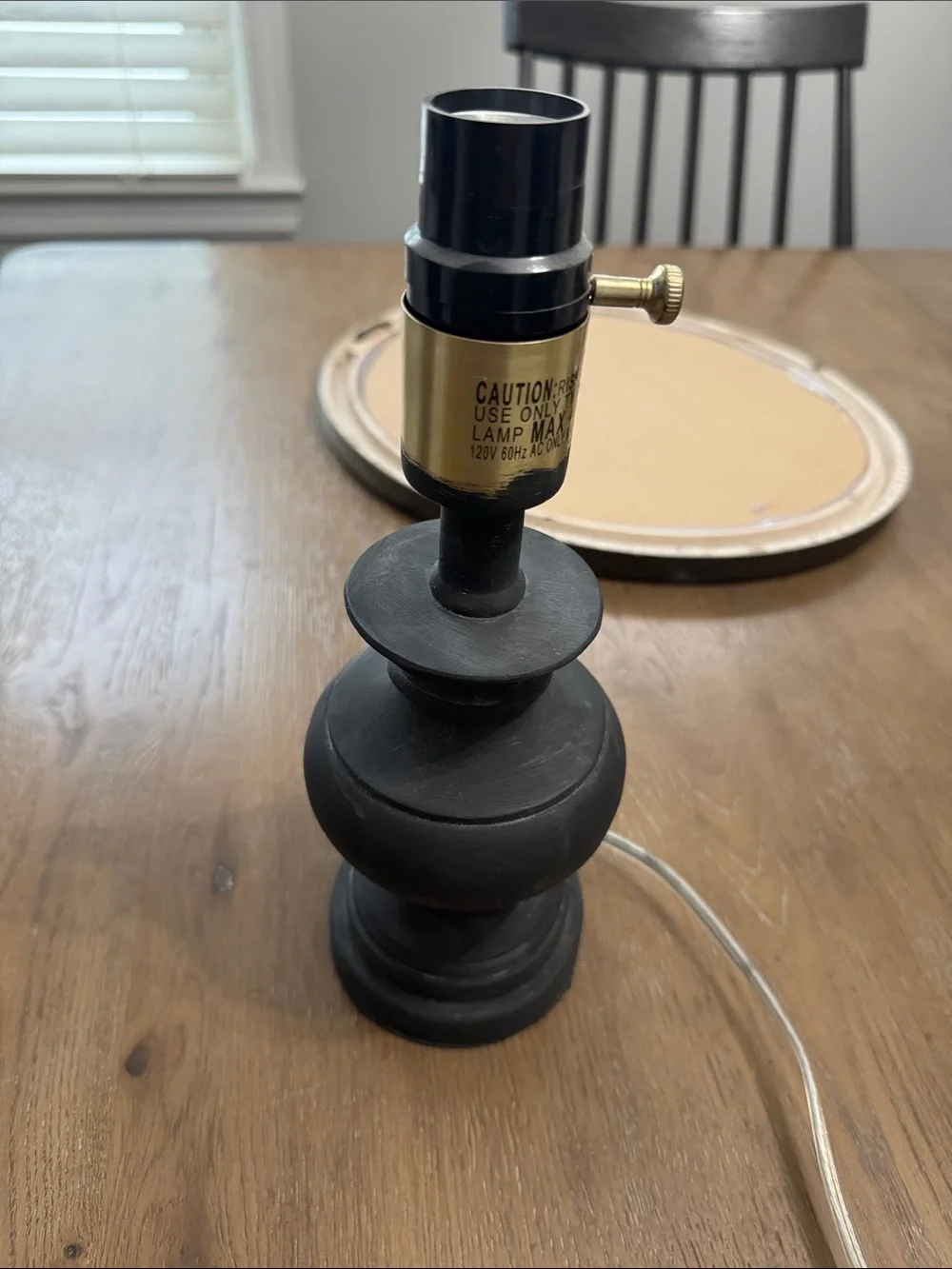 Small black lamp painted with chalk paint.